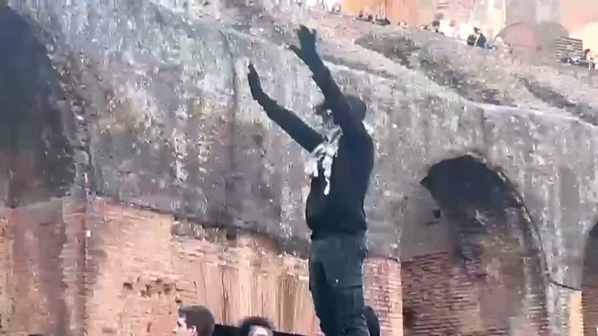 Protesters force their way into the Colosseum in Rome