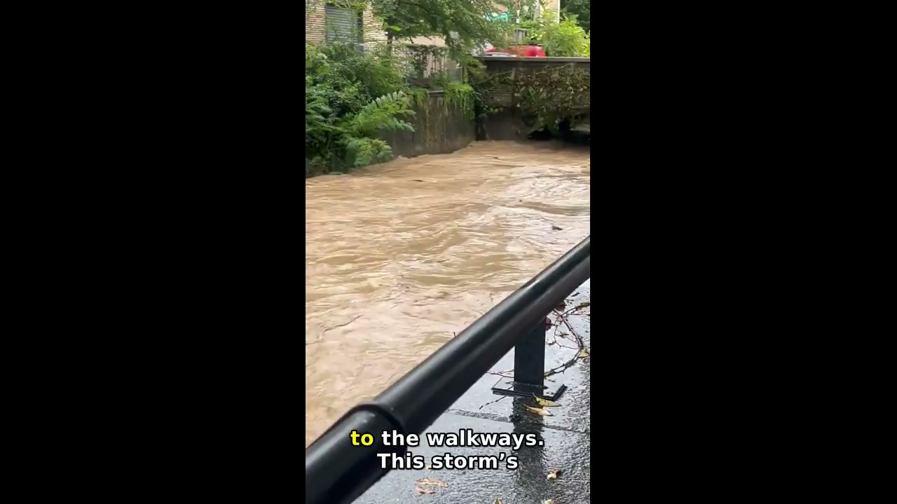 Floodwaters flow through Milan canal