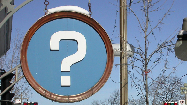 What does a blue road sign with a question mark mean?
