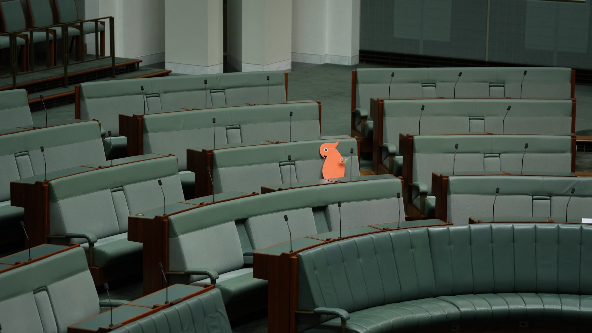 A cardboard cockatoo sits in tribute for Helen Haines as MPs are urged to let light win over darkness