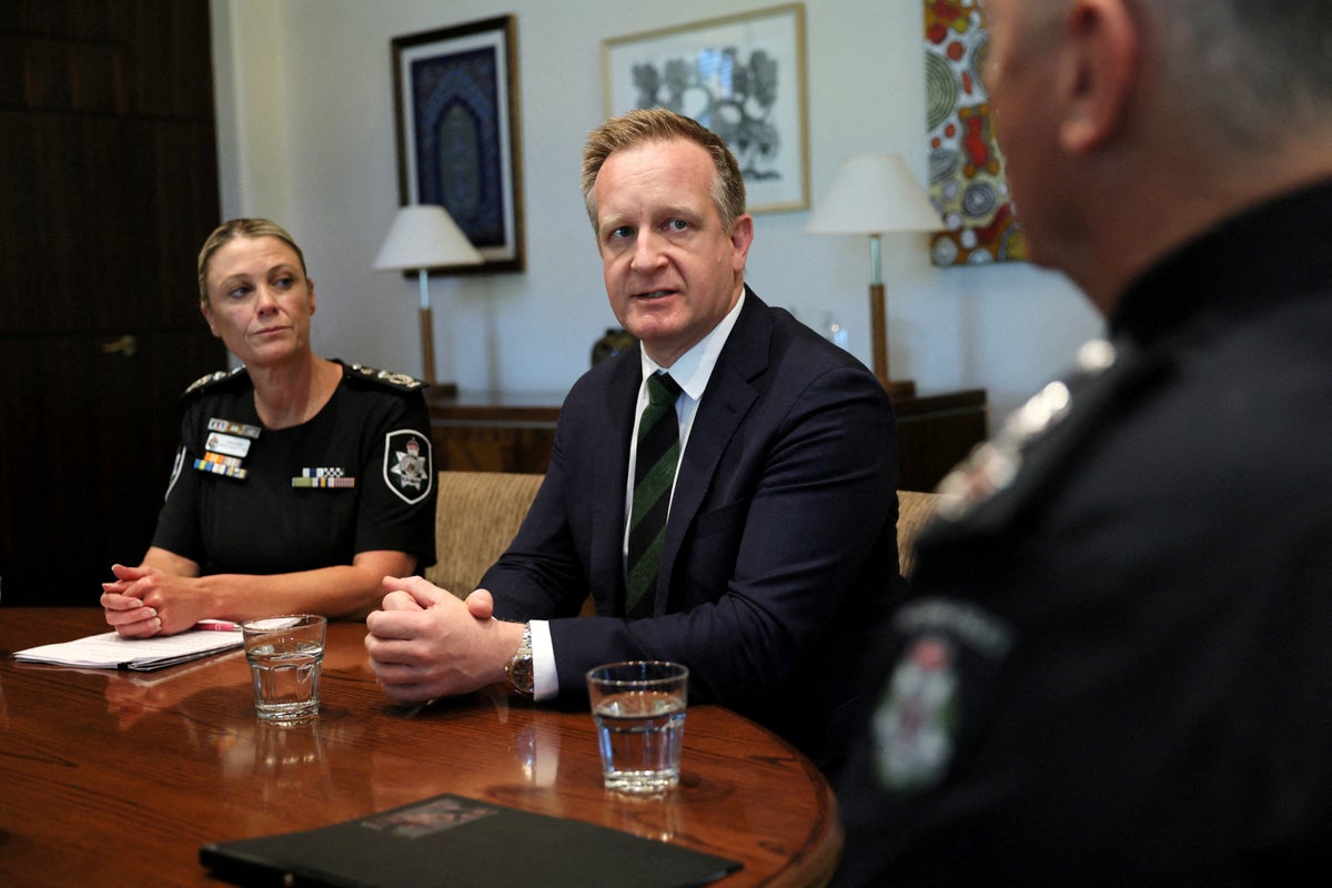 Australian minister says bullet etched with 'RAT' left on his car