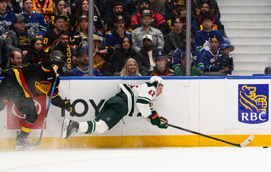 Quinn Hughes has a goal and an assist in his Vancouver return in Wild's ...