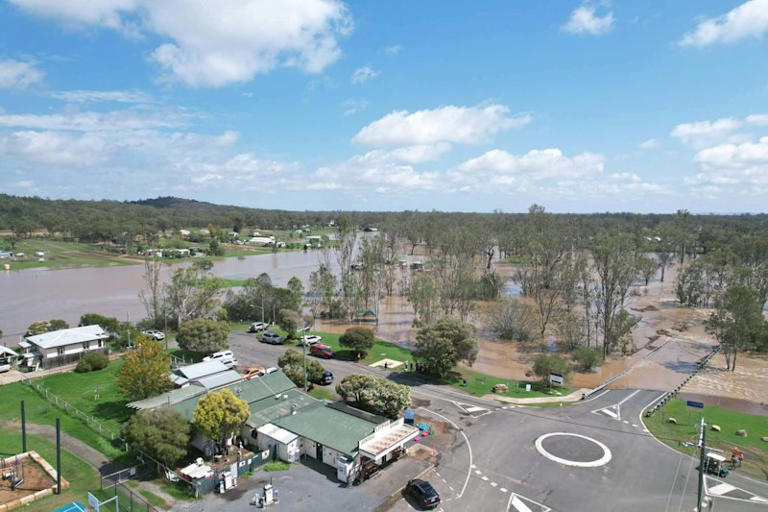 Man found dead in floodwater as heavy rain blankets Brisbane