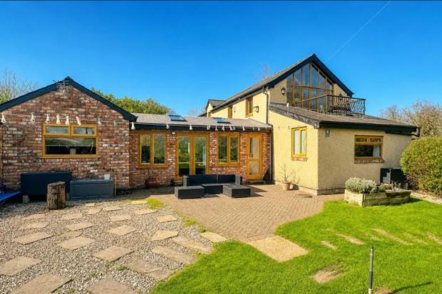 Neston barn conversion with 6.5 acres, fishing lakes and established ...