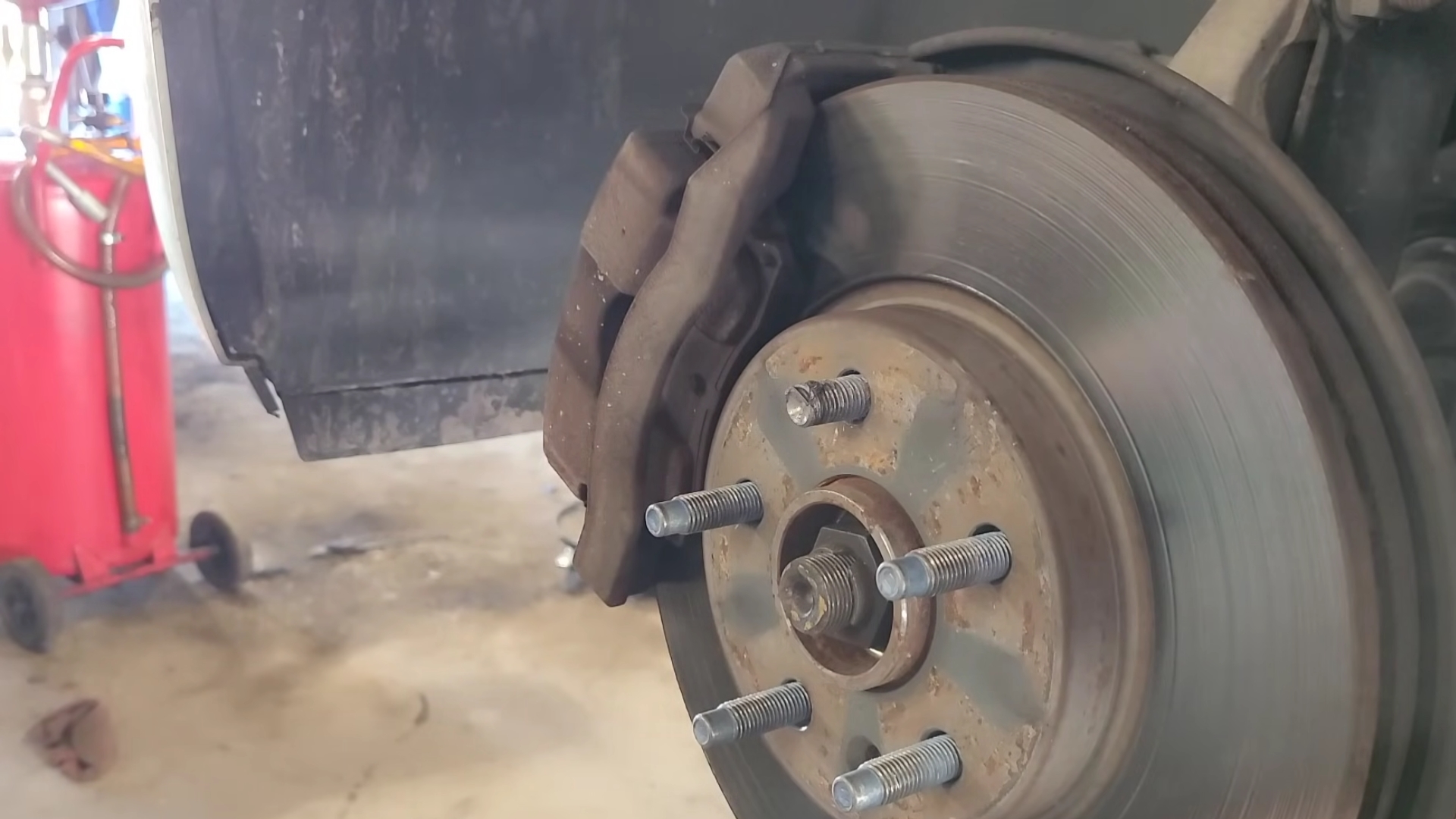How to handle a spinning wheel stud and seized lug nut