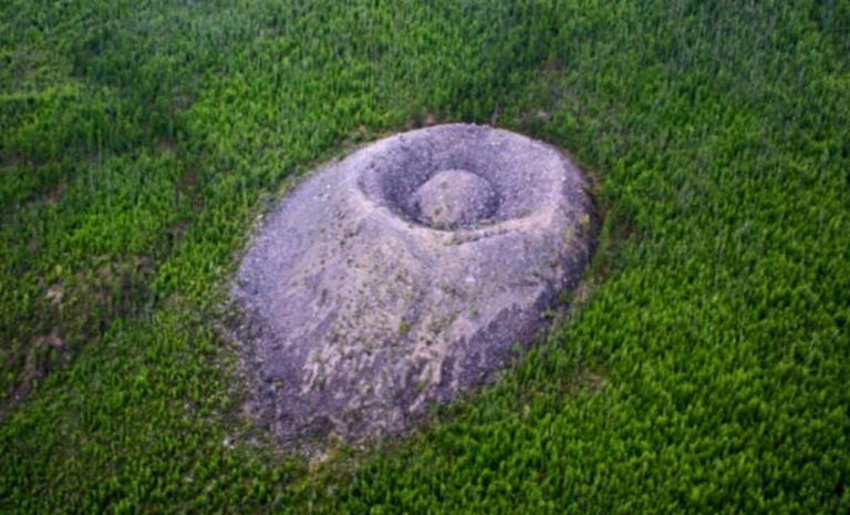 A mysterious 40-meter cone of about a million tons of limestone rises ...