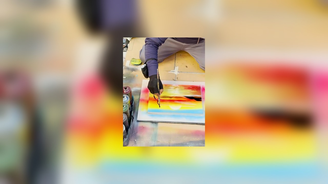 Street artist spray paints my boss’s laptop in Rome