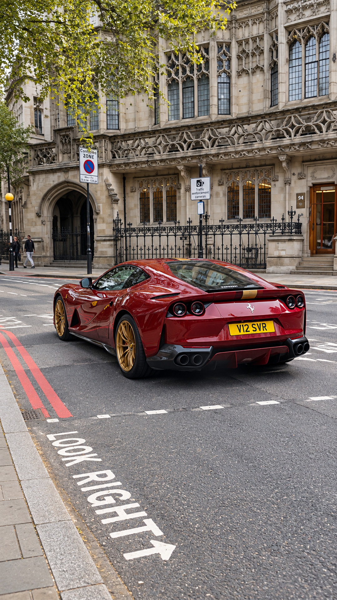 This red Ferrari has a serious golden touch on its wheels
