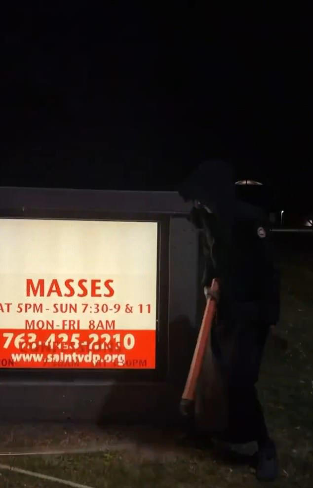 Man in robes filmed smashing sign outside Minneapolis Catholic church