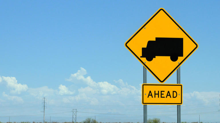 What does a yellow road sign with just a truck on it mean?
