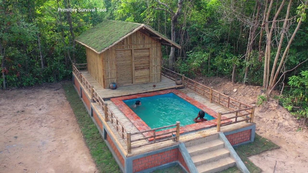 Bamboo cabin and turquoise pool from above