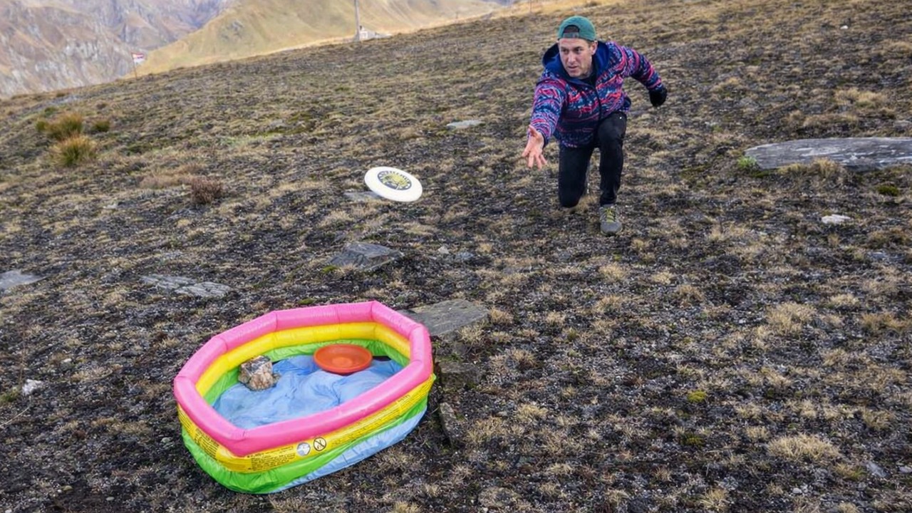 Playing mountain golf with frisbees, basketballs and soccer balls