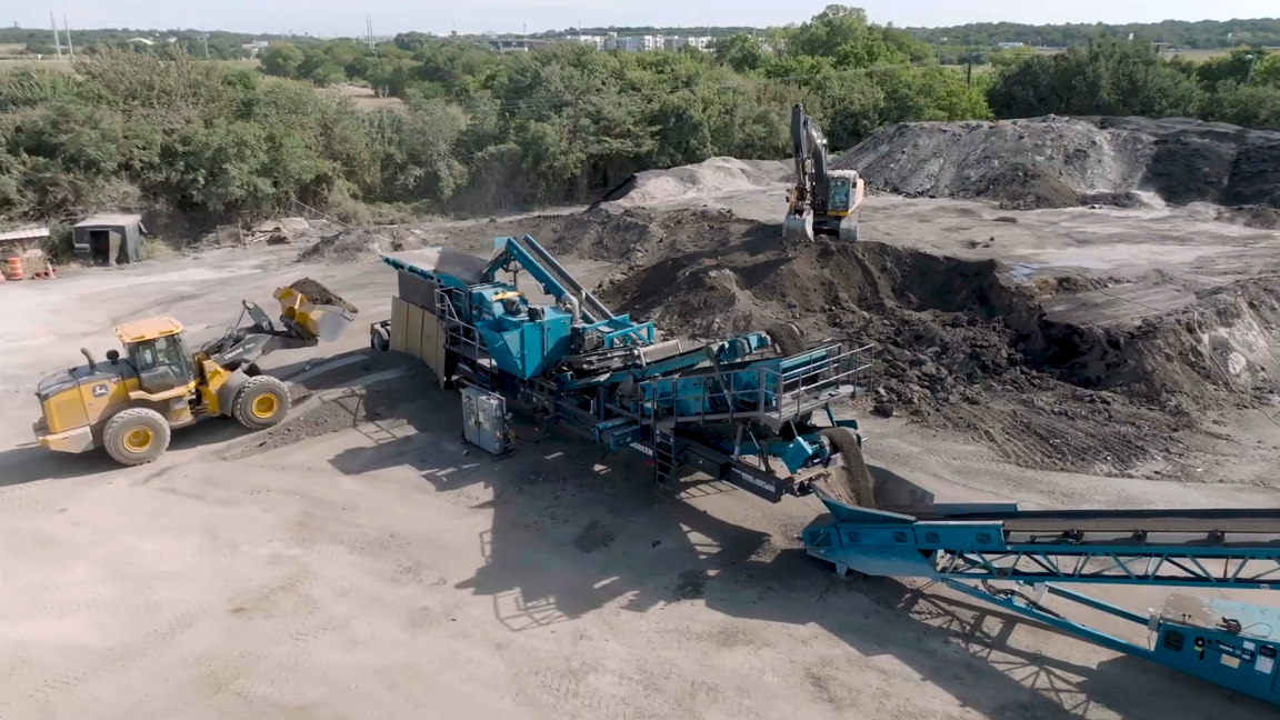 Heavy equipment working at a mobile aggregate screening site