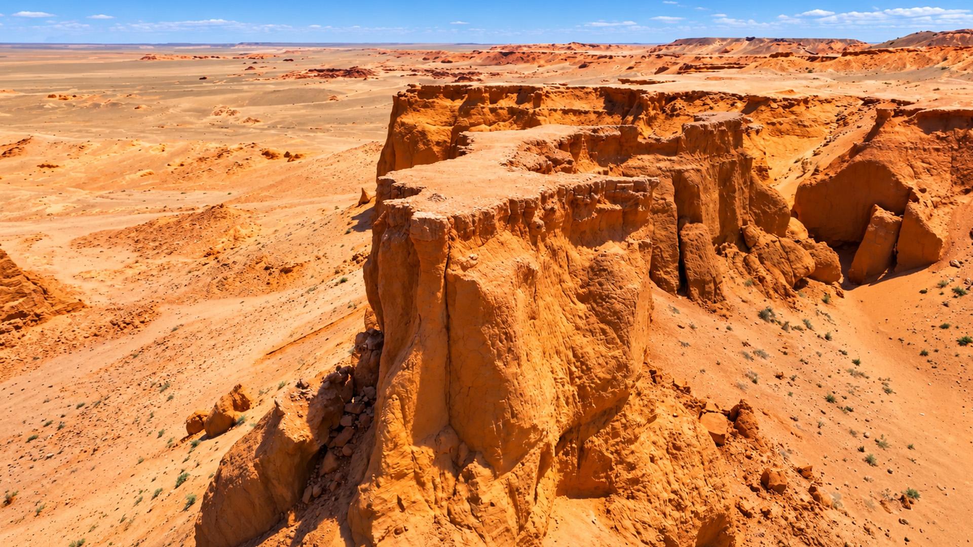 What lies beyond this giant desert cliff?
