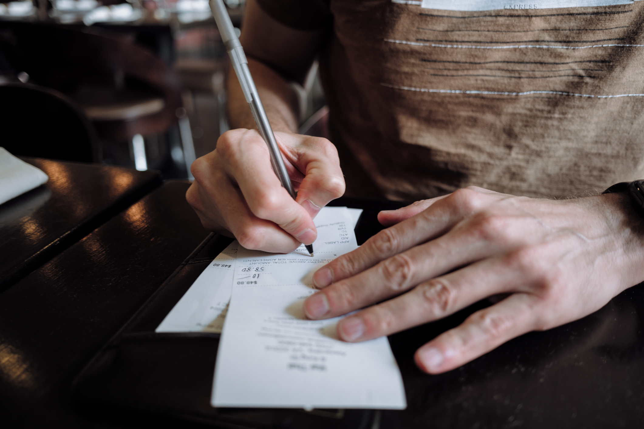 Americans hate tipping. So why haven’t they stopped?