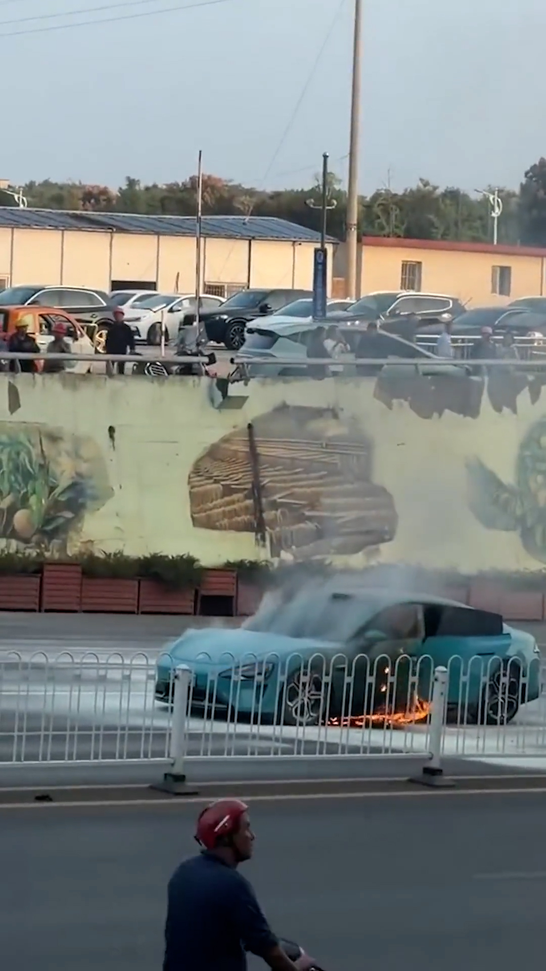Electric car bursts into flames as suspected battery fire breaks out