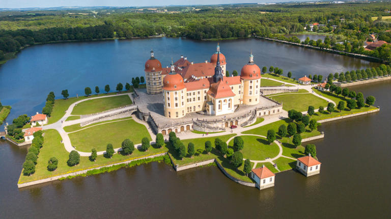 Settled on a man-made lake in Germany is a 16th century hunting lodge ...