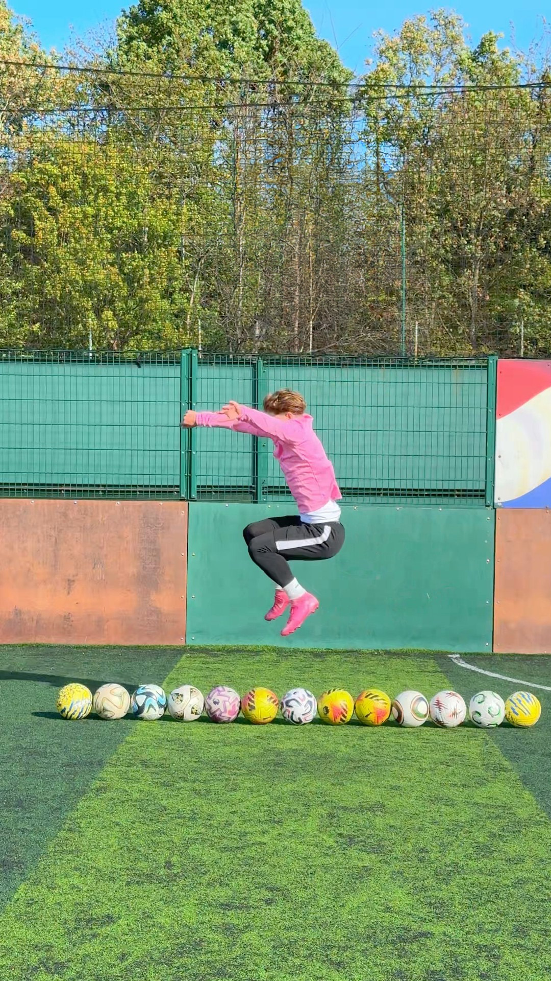 How many footballs can one jump clear?