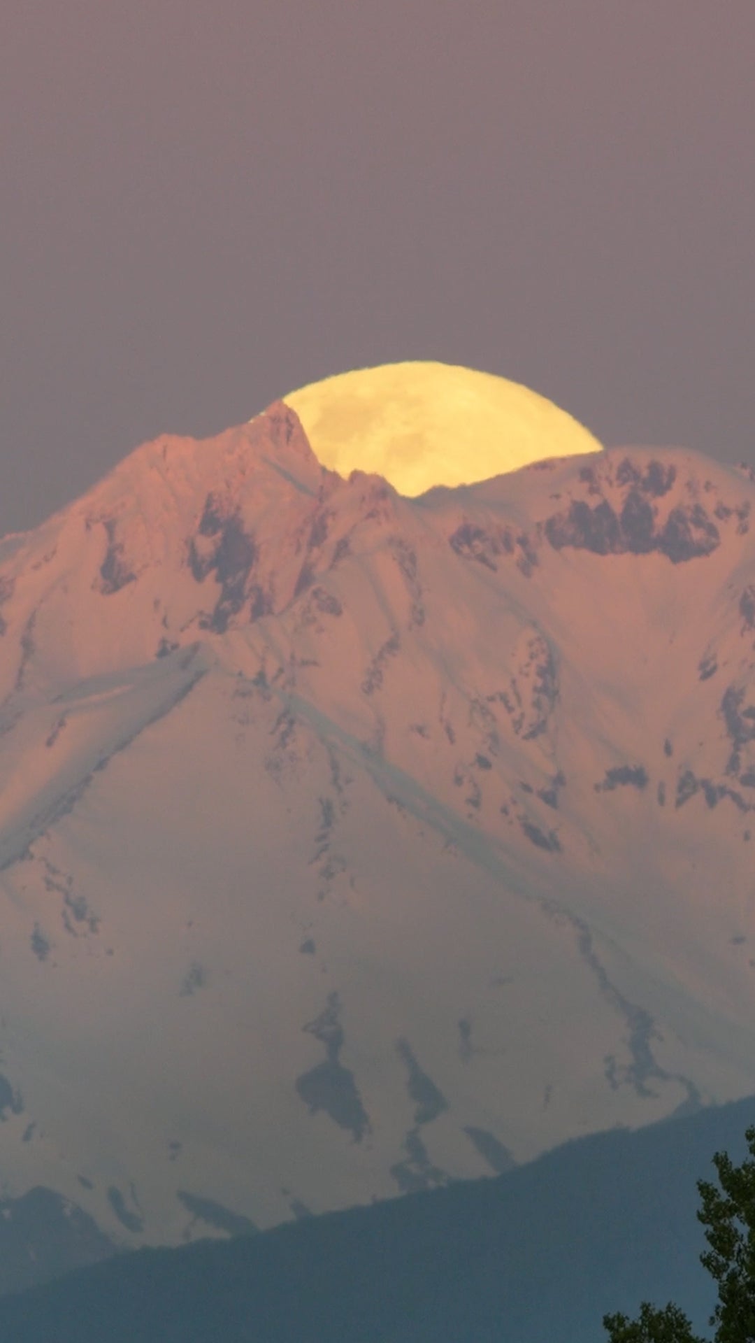 Hunter’s moon rises over volcano