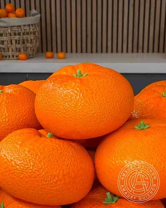 Amaury Guichon crafts a realistic mandarin pastry inside an edible ...