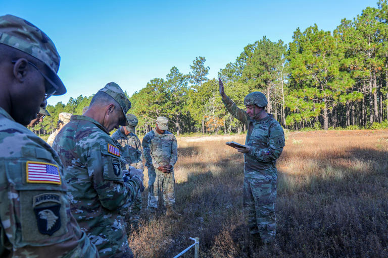 US Army practices digging temporary battlefield graves