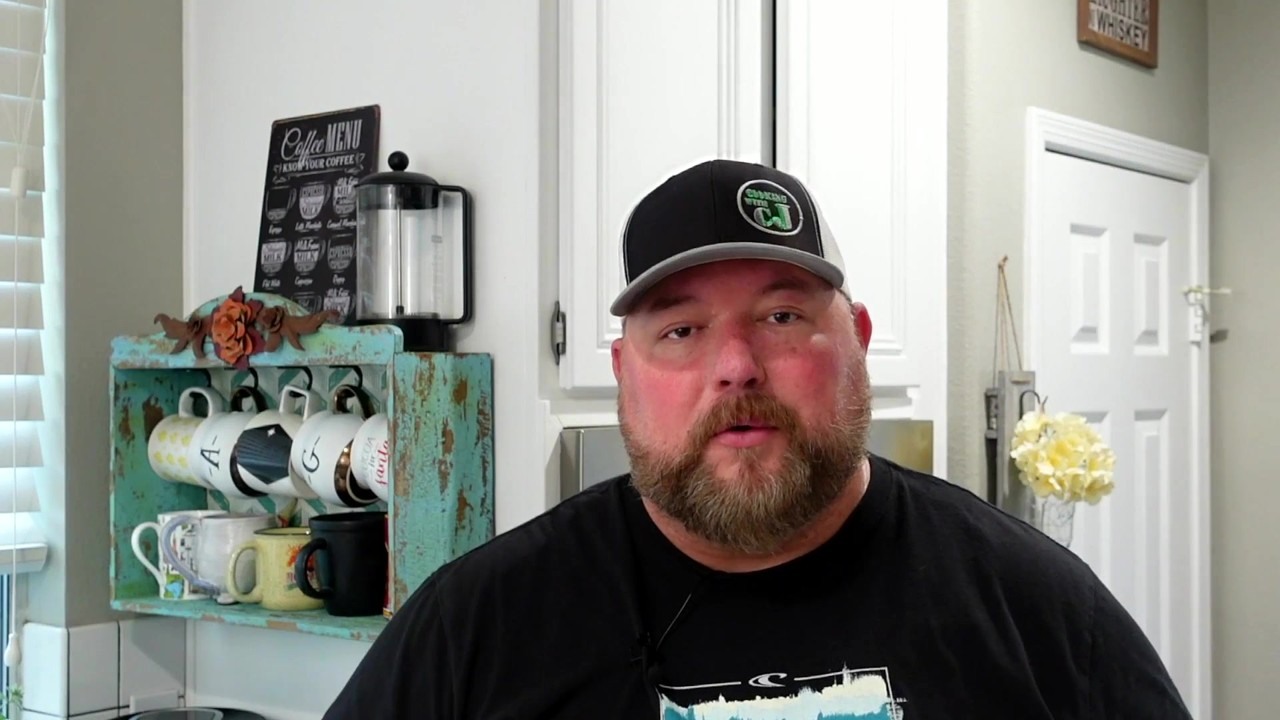 CJ roasts a whole chicken in the Ninja Foodi XL grill