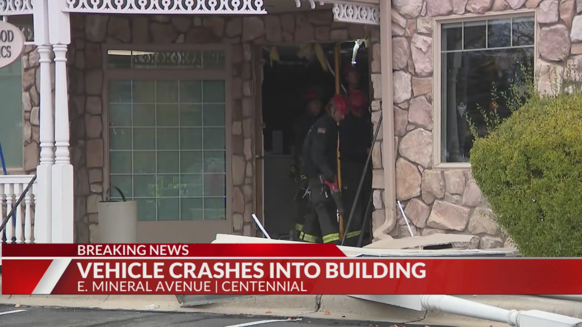 Vehicle crashes through front door of building in Centennial