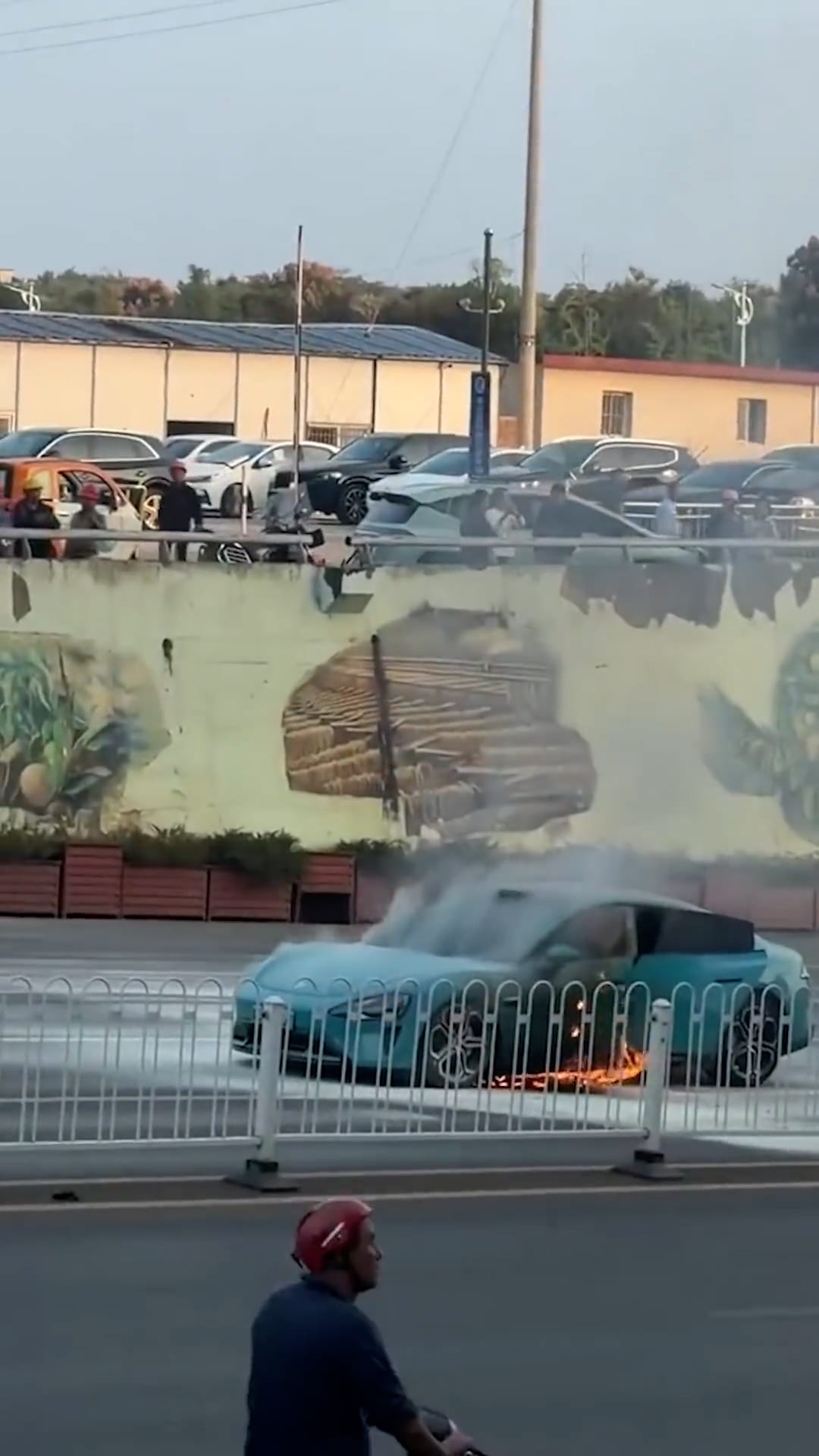 Electric car bursts into flames as suspected battery fire breaks out