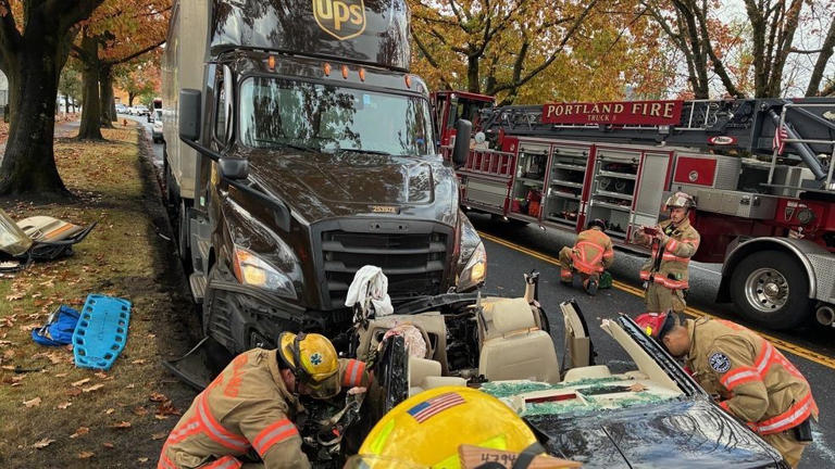 Portland firefighters rescue driver after crash with semi truck near ...