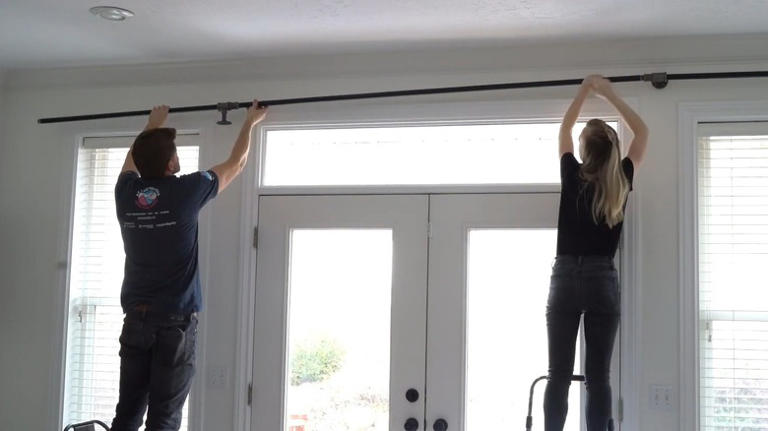 Skip the basic curtain rods: Add a sleek industrial touch with steel
