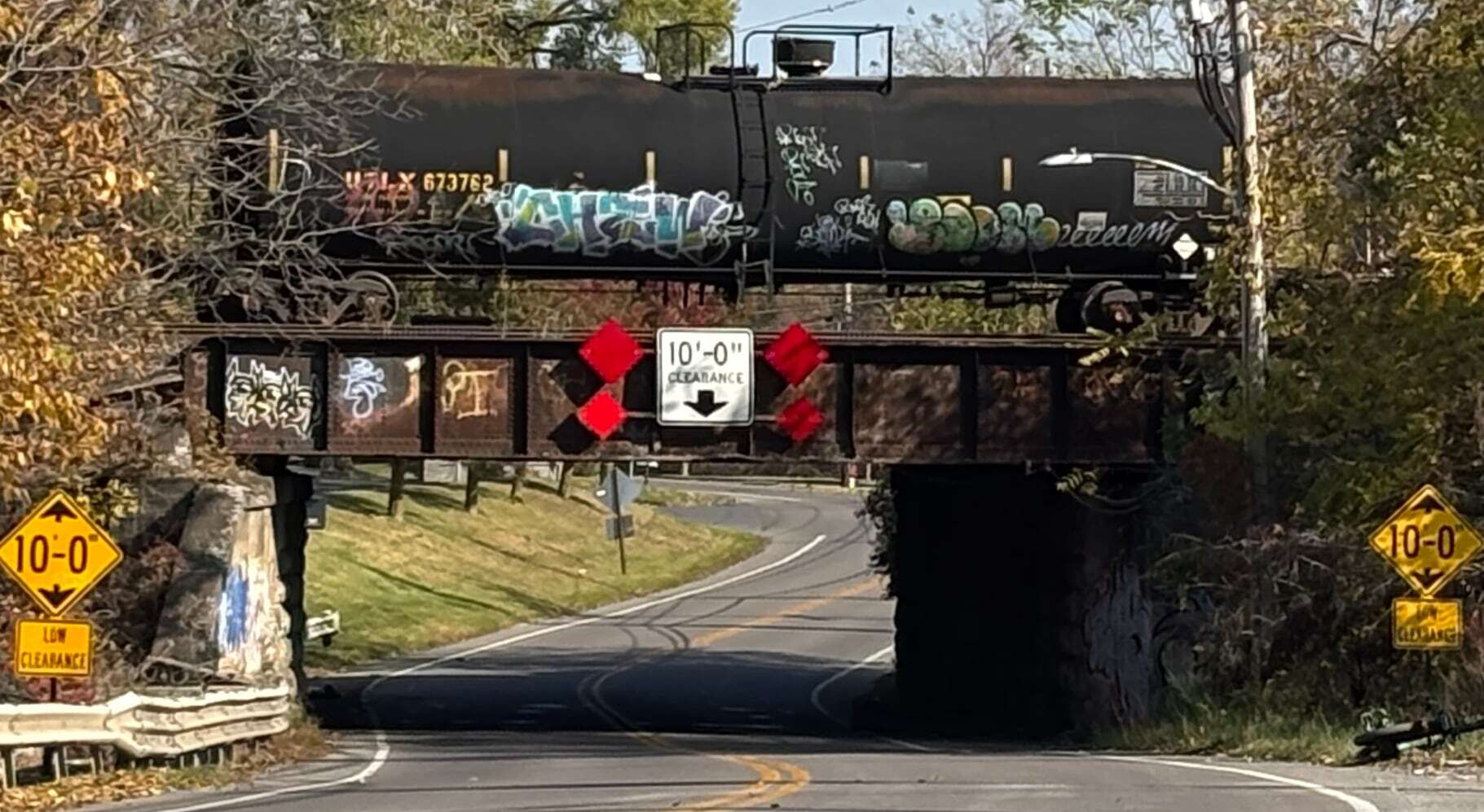 Box truck hits railroad bridge in DeWitt