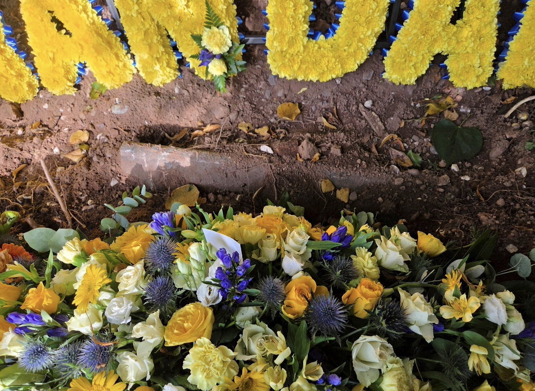 Family's heartbreak after dad's coffin found inches underground