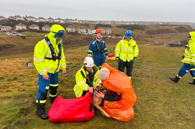 Man and dog rescued from sea cave in cliff rope rescue during Storm Boelo