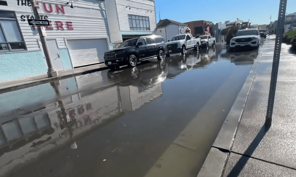 Water floods Newport Beach streets with possible record high tides ahead