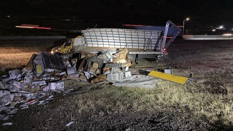 Box truck overturns on SR-201 ramp after sliding on unknown chemical spill