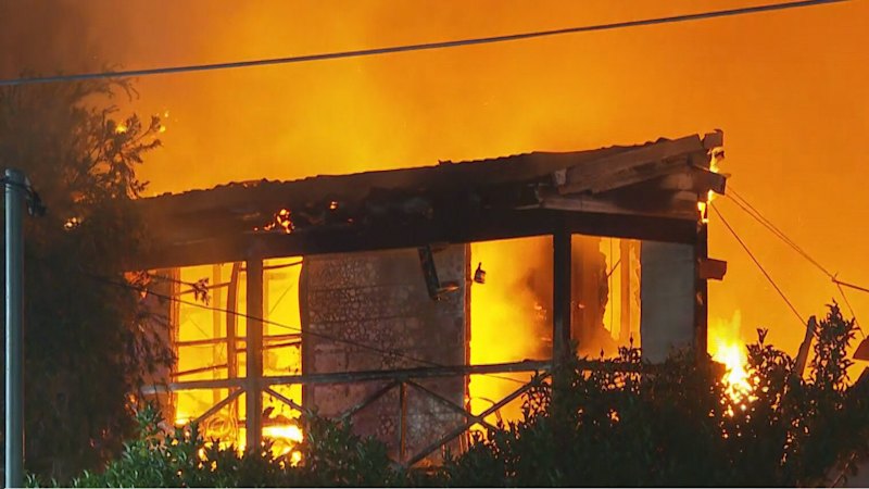 Civilian praised over house fire rescue as balaclava-clad man sought