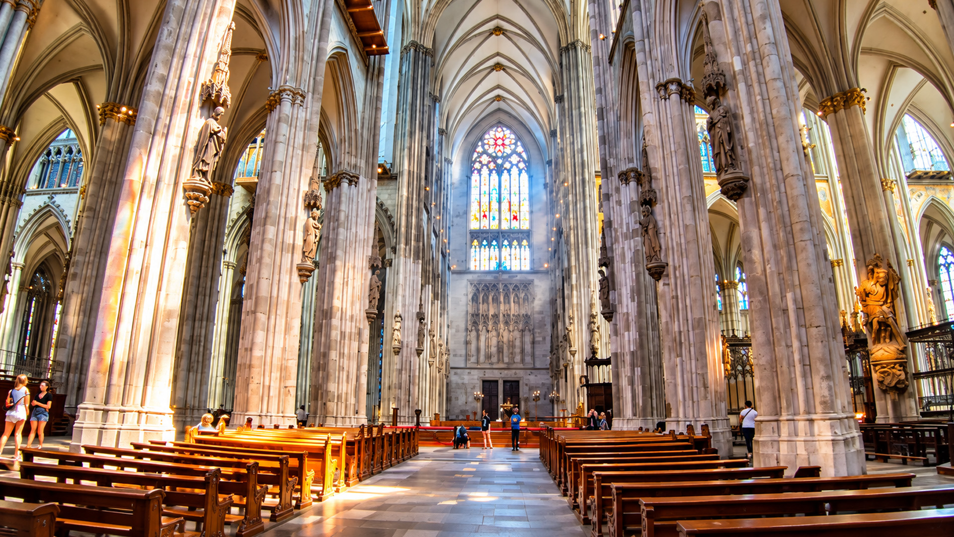 How high do these giant stone columns in Cologne Cathedral rise?
