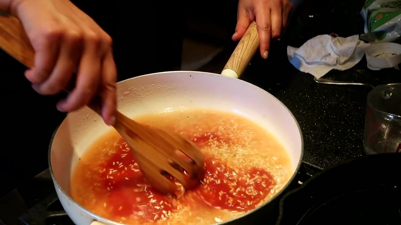 Mexican red rice starts with dry rice toasted in oil