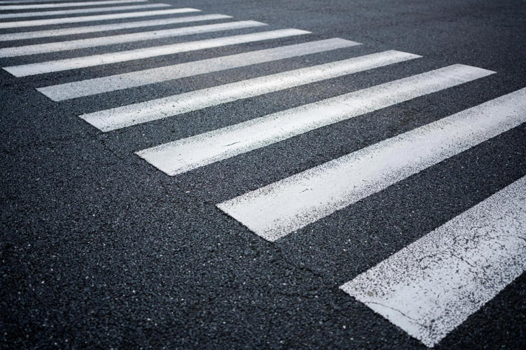 The stripes on a pedestrian crossing were painted on because the ...