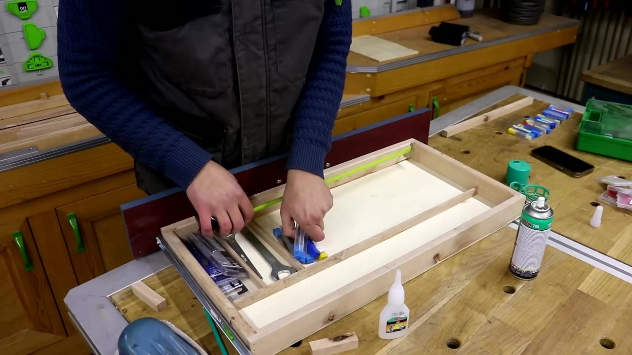 A craftsman builds a compact CNC computer table