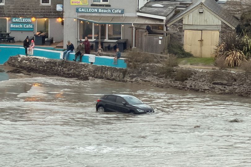 Car nearly swallowed up at high tide on Cornwall beach