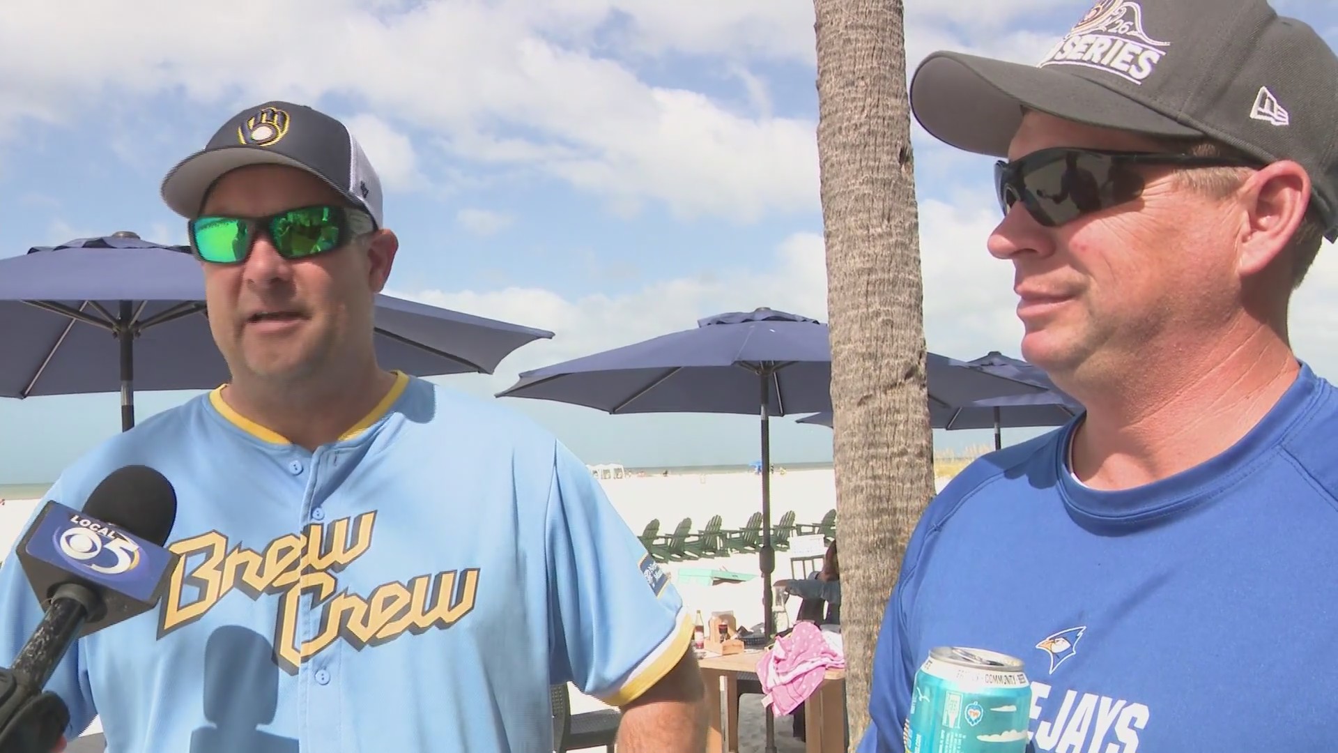 Sports director Kyle Malzhan interviews Brewers fans on Florida beach