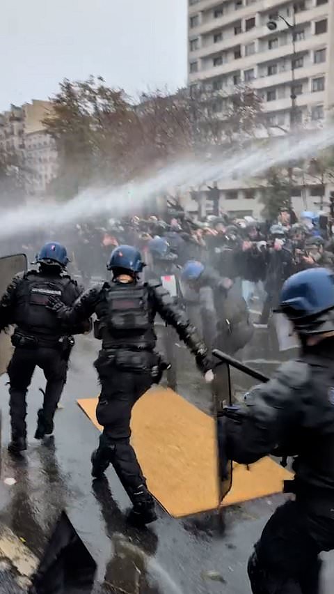 Police and protesters clash in Paris