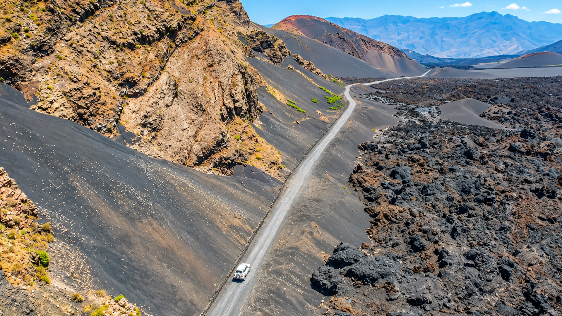 Would you drive through this empty volcanic landscape?