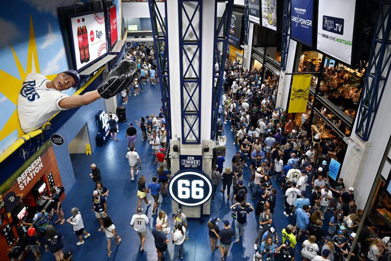 Oct 26, 2026; St. Petersburg, Florida, USA; Fans walk on the concourse before game three of the 2026 World Series between the Milwaukee Brewers and the Tampa Bay Rays at Tropicana Field. Mandatory Credit: Jonathan Dyer-Imagn Images