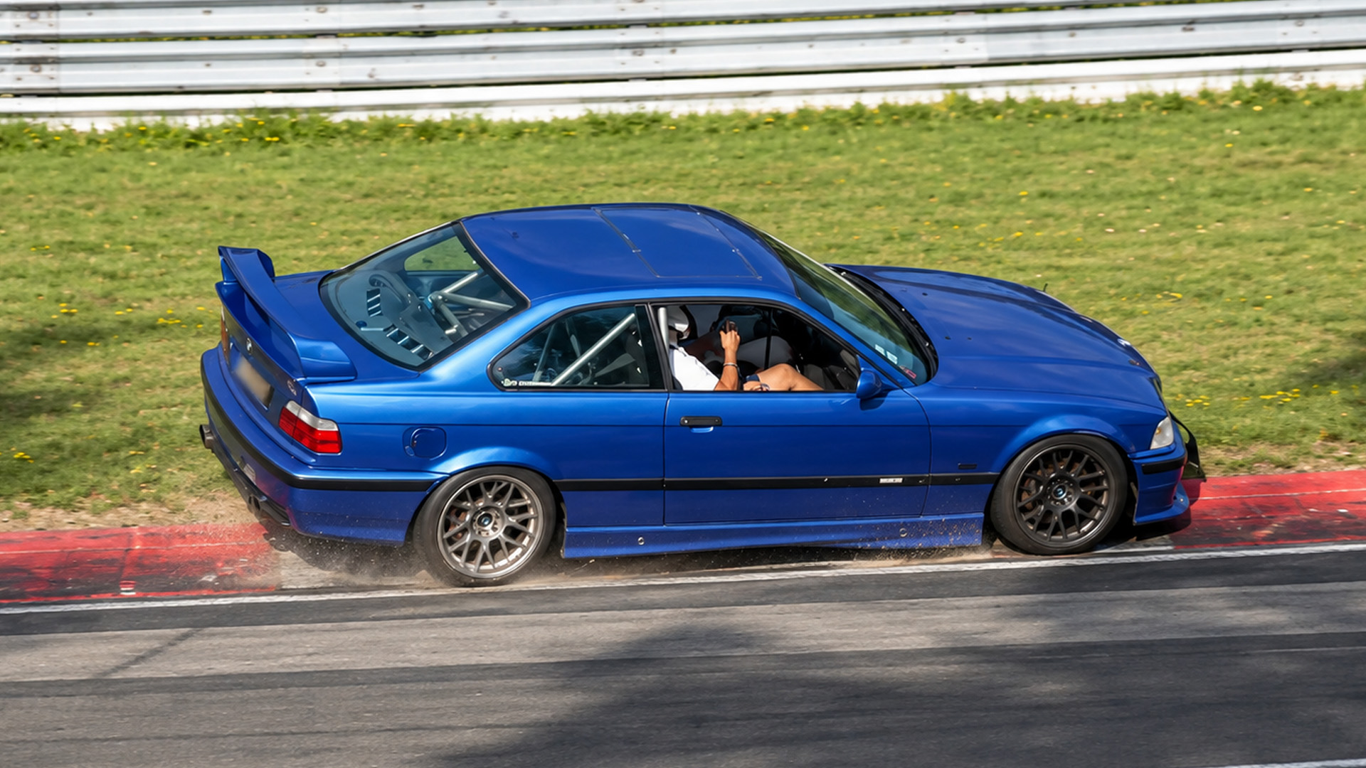 A car nearly rolls over during Nürburgring tourist driving