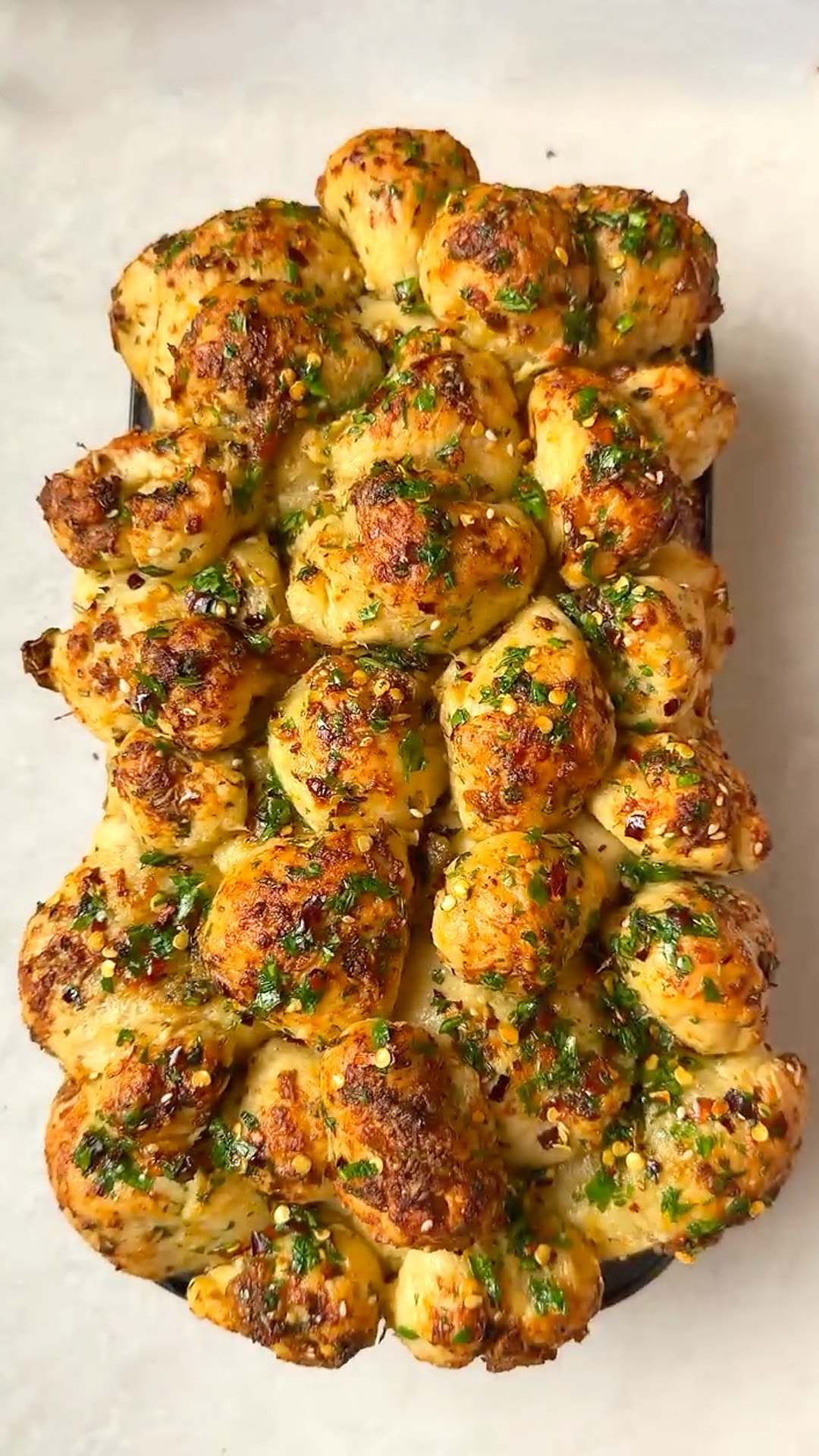 Pull apart garlic bread with vegan parmesan