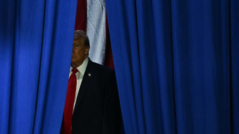 President Donald Trump arrives to speak at a midterm election campaign rally at Sioux Gateway Airport in Sioux City, Iowa, on October 22. - Kent Nishimura/AFP/Getty Images
