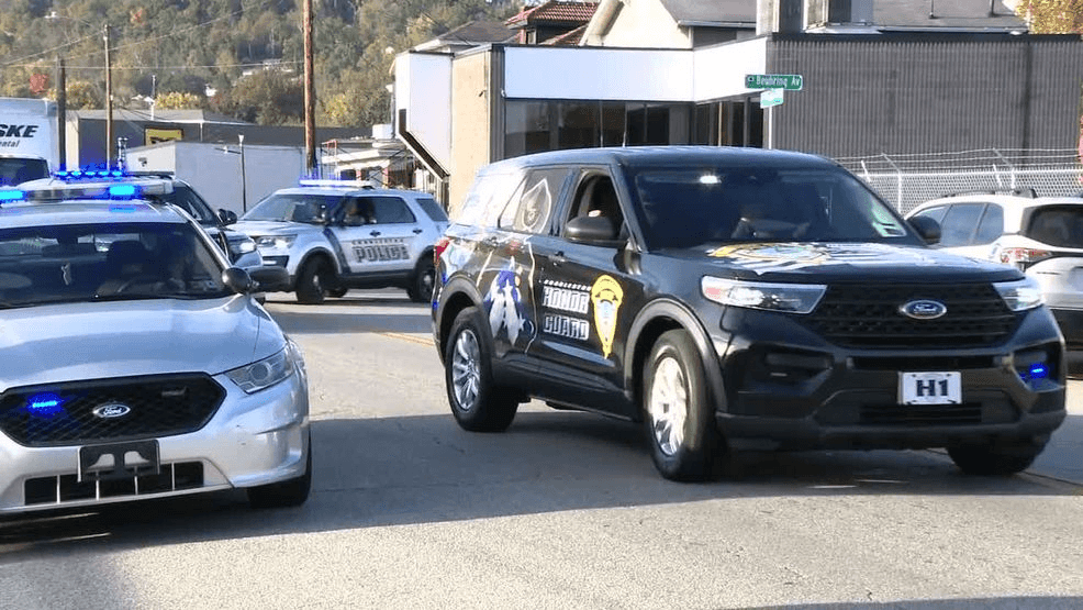 Police and community escort Deputy Mullens’ body from Charleston to Man ...