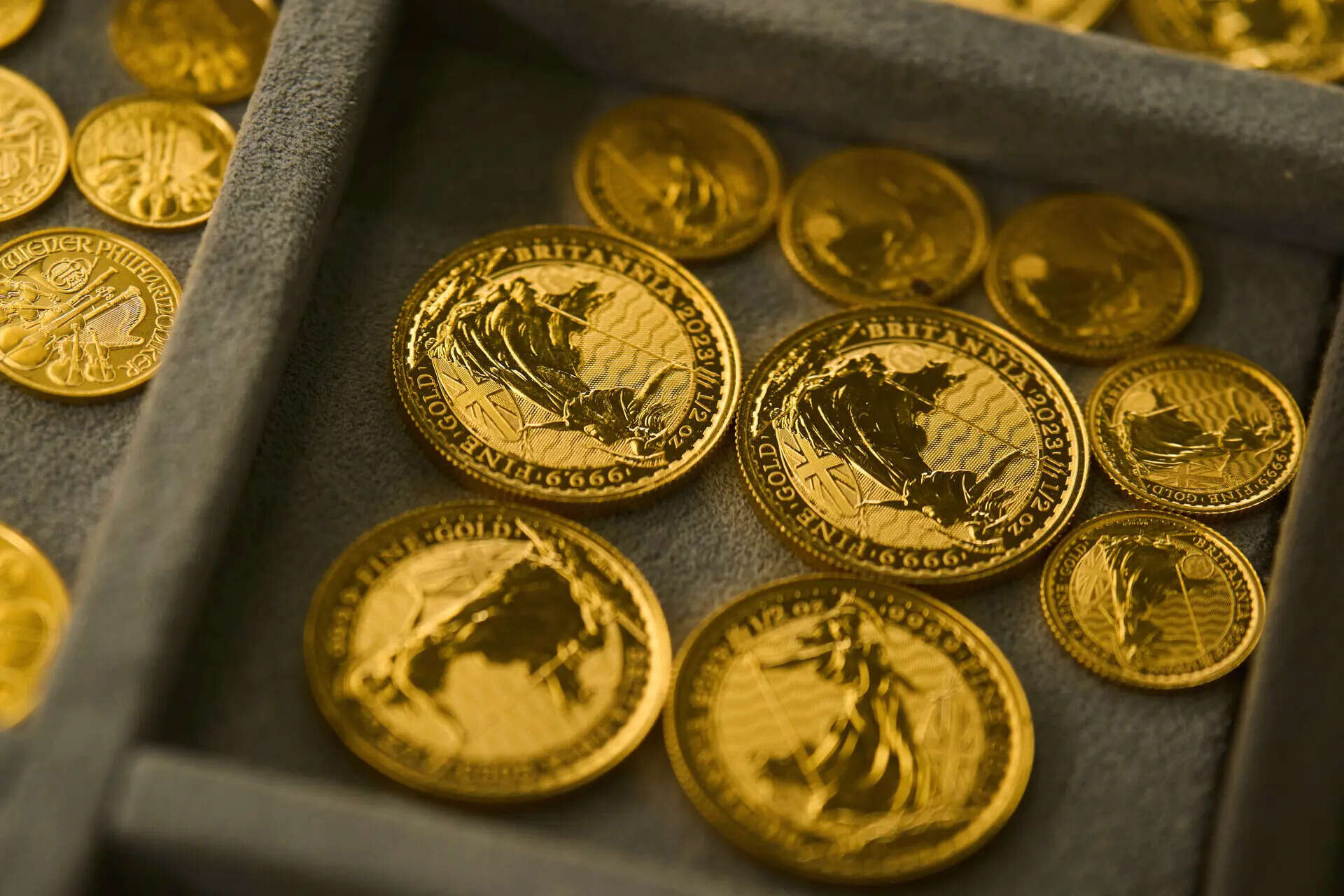 Gold eases as stronger dollar weighs, Fed meeting in focus